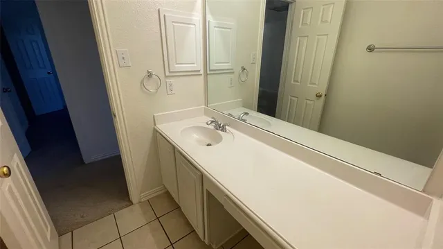 a white toilet sitting next to a bath tub