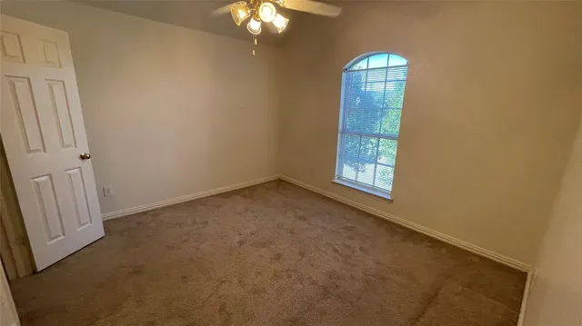 a view of a pathway with a yard