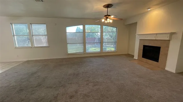 a kitchen with a sink window and cabinets