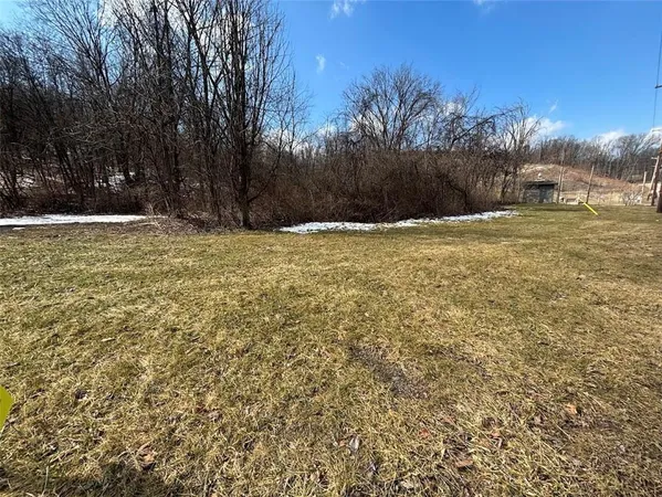 a view of swimming pool next to a yard