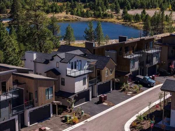 an aerial view of a houses with yard