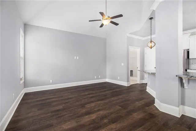 wooden floor in an empty room with a window