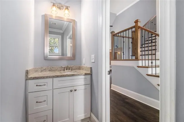 a view of entryway with a window and wooden floor
