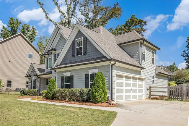 a front view of a house with garden