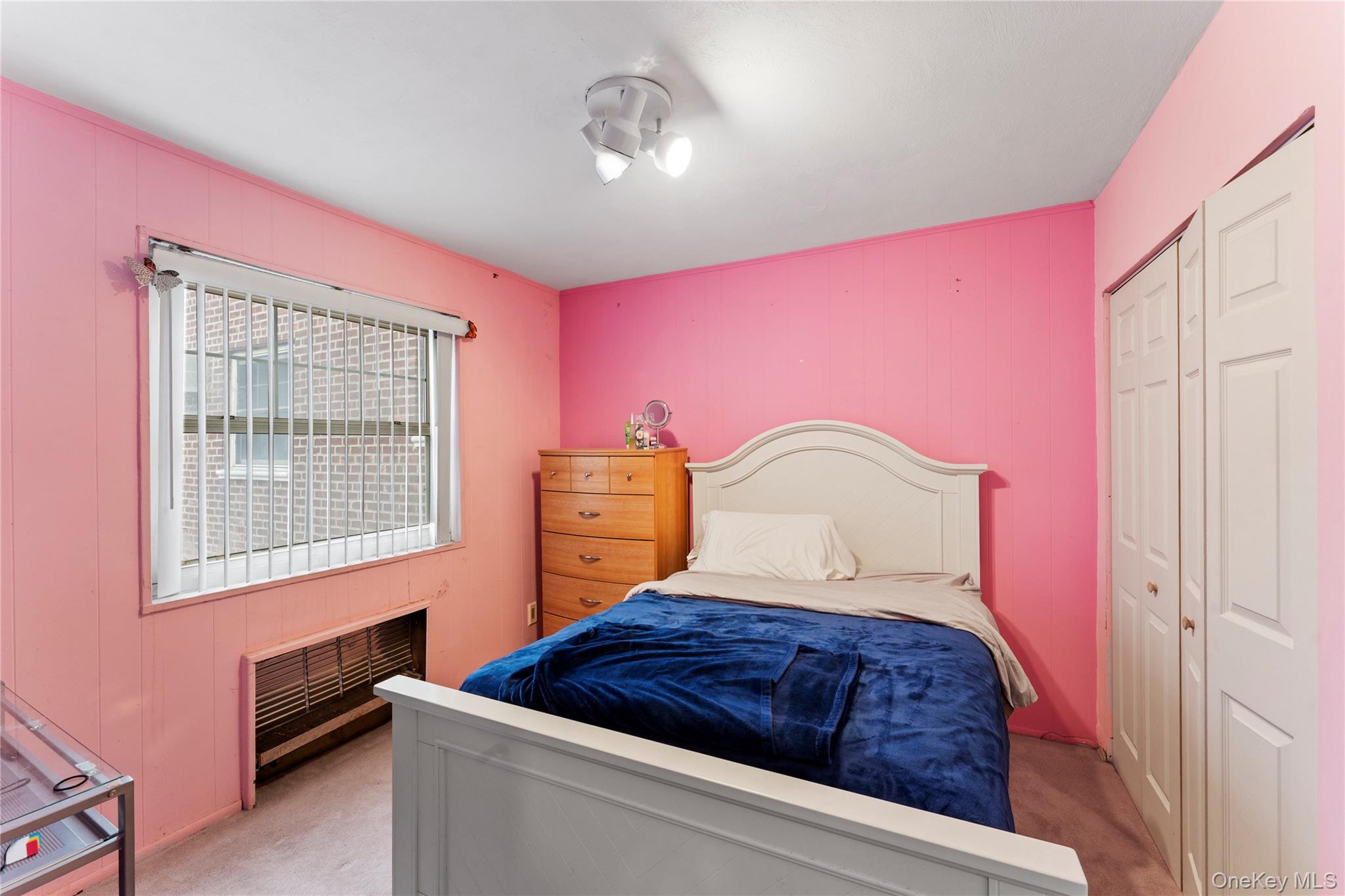 251-29 61st Avenue, Unit 2719 Queens, NY 11362 - Photo 14 of 19 a bedroom with a bed and dresser