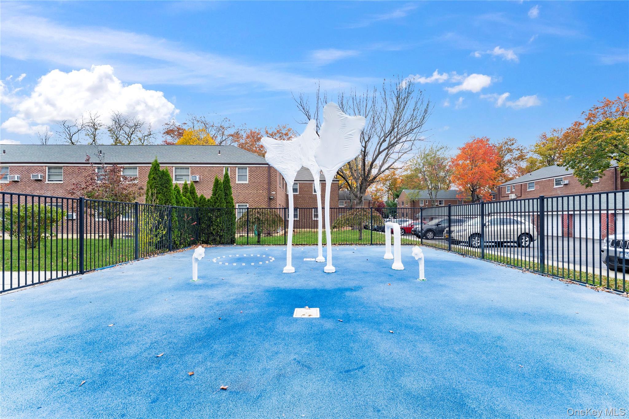 251-29 61st Avenue, Unit 2719 Queens, NY 11362 - Photo 18 of 19 a view of a park with swings