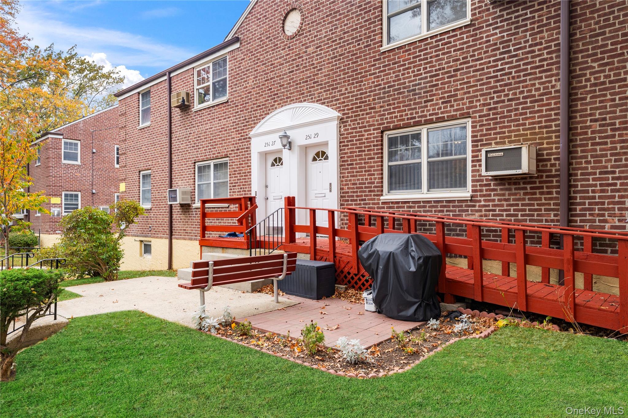 251-29 61st Avenue, Unit 2719 Queens, NY 11362 - Photo 2 of 19 a front view of a house with garden