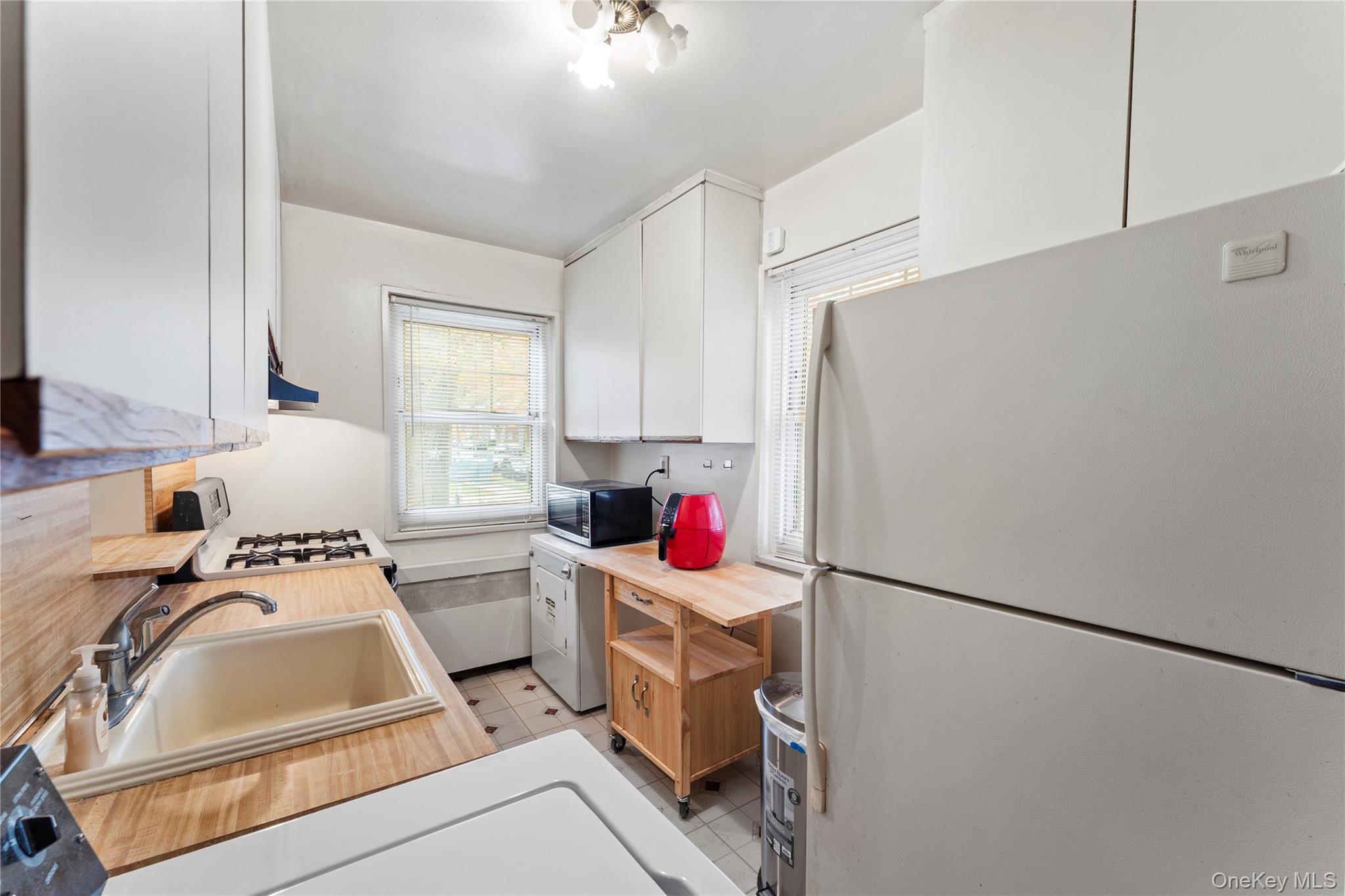 251-29 61st Avenue, Unit 2719 Queens, NY 11362 - Photo 6 of 19 a room with storage and utility