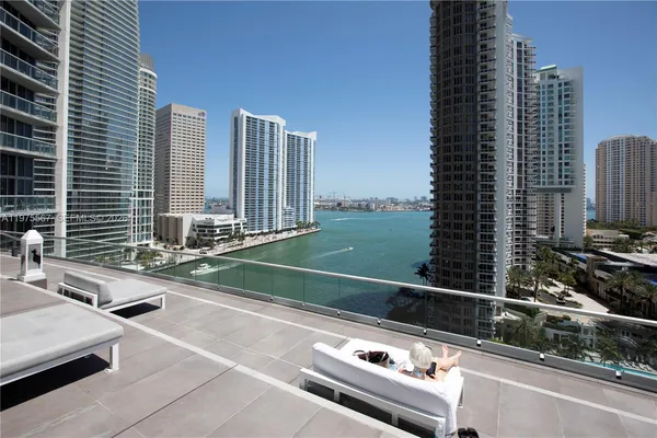 a view of a balcony with a floor to ceiling windows