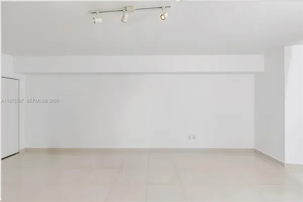 a view of white bath tub sitting in a room