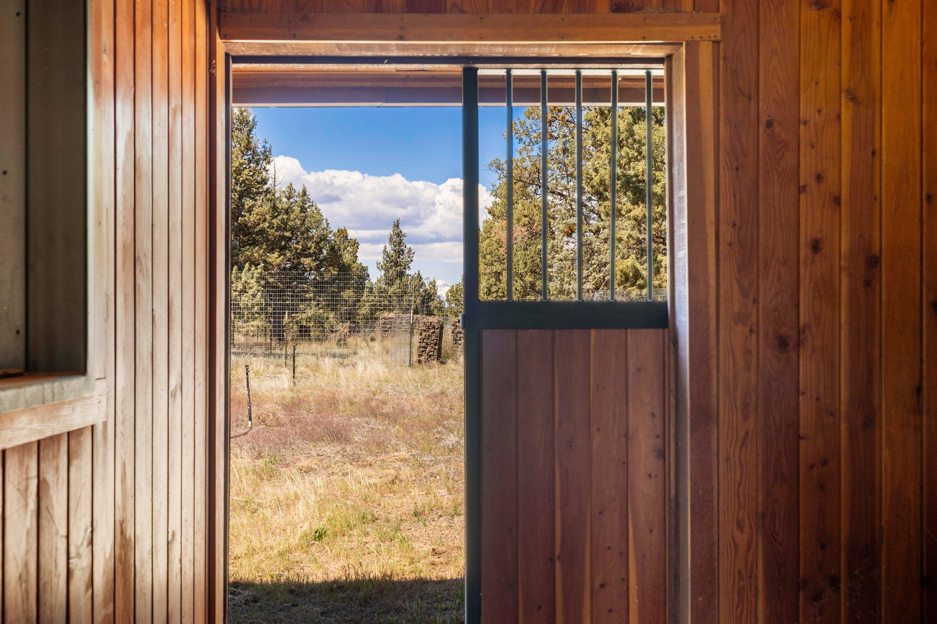 64155 Hunnell Road Bend, OR 97703 - Photo 69 of 96 Stalls with turn-out doors.