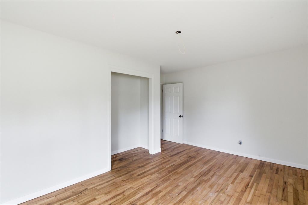 203 North Kickapoo Street Lipan, TX 76462 - Photo 15 of 28 a view of a room with wooden floor