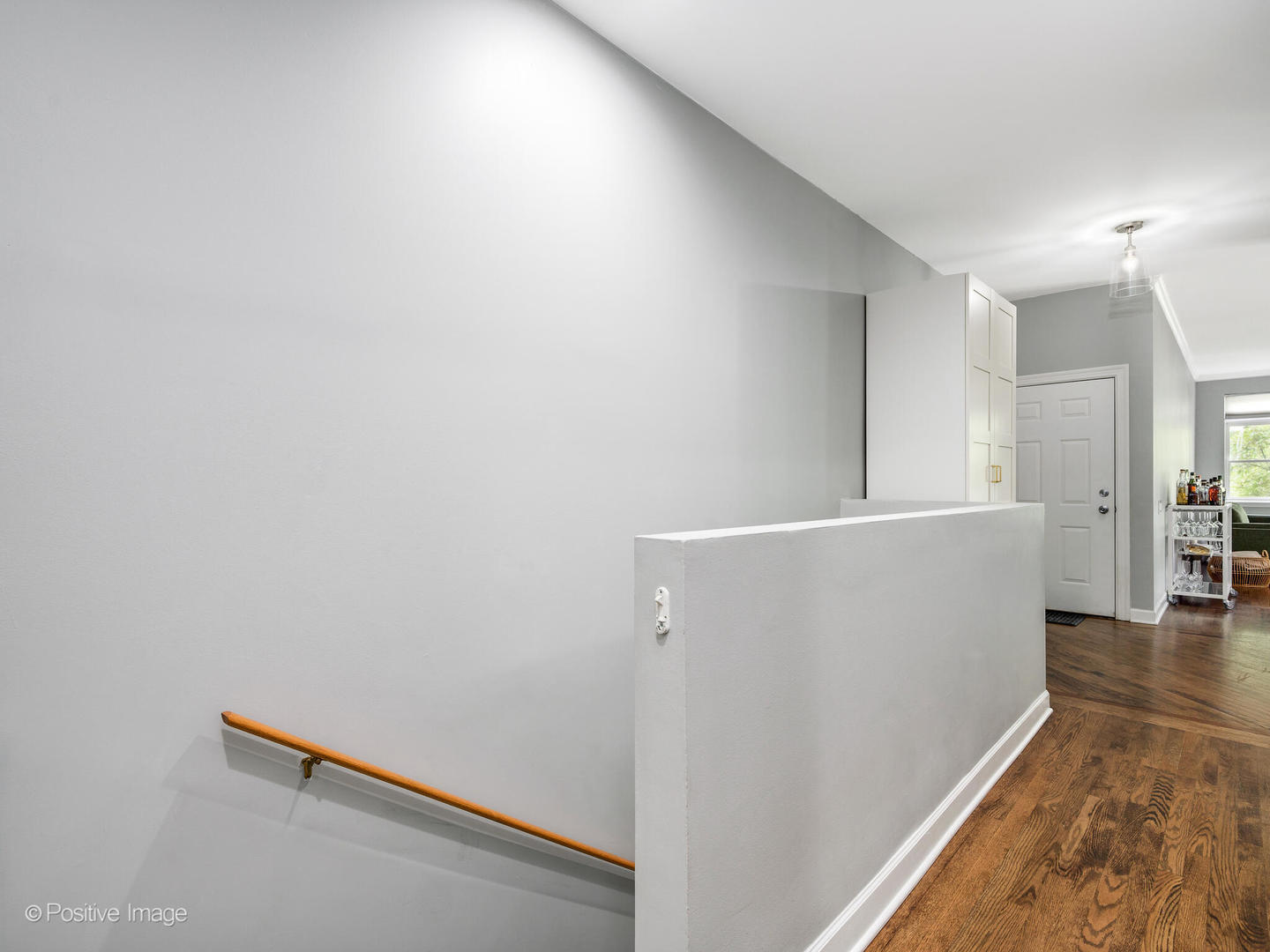 4315 North Kenmore Avenue, Unit 1N Chicago, IL 60613 - Photo 12 of 27 a view of a hallway with wooden floor