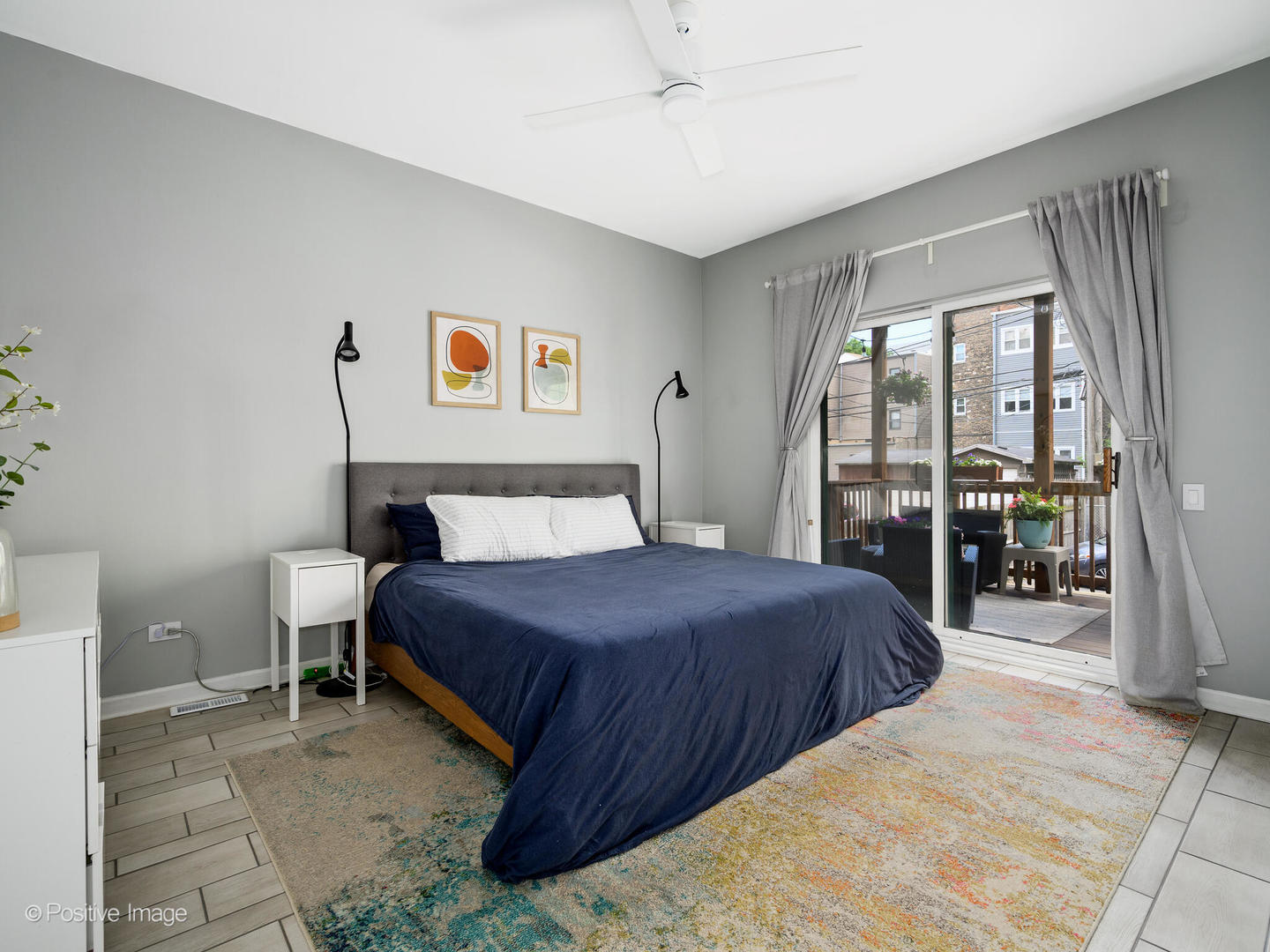 4315 North Kenmore Avenue, Unit 1N Chicago, IL 60613 - Photo 13 of 27 a bedroom with a bed and a large window