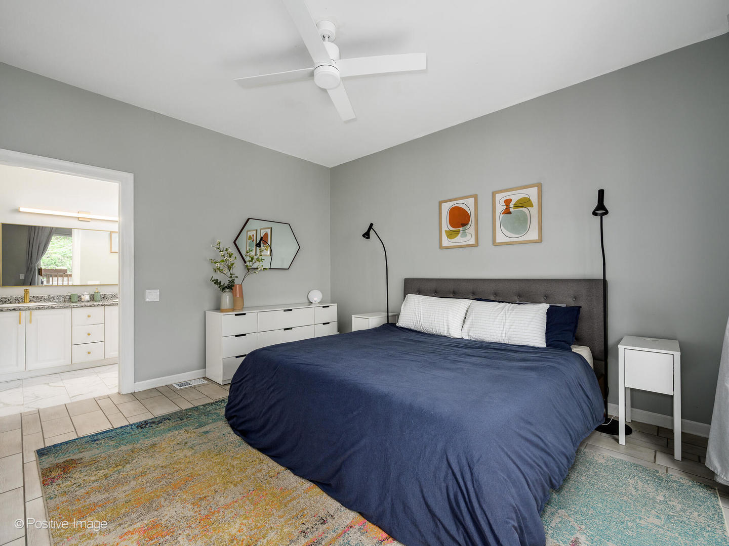 4315 North Kenmore Avenue, Unit 1N Chicago, IL 60613 - Photo 14 of 27 a bedroom with a large bed and a chandelier