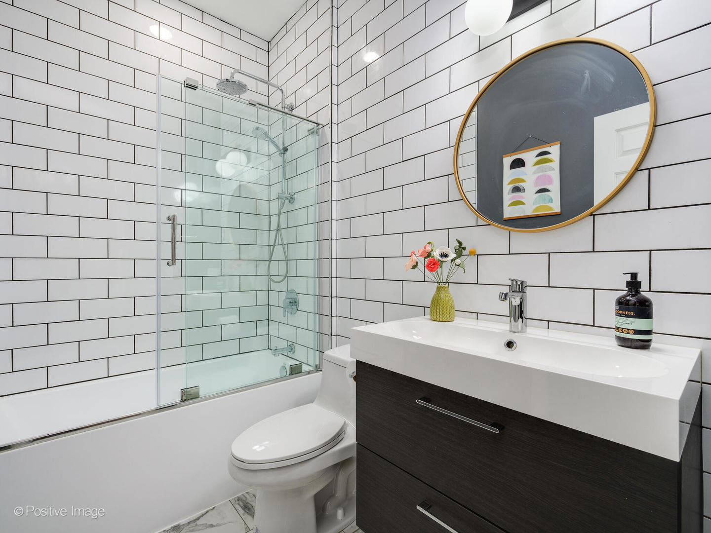 4315 North Kenmore Avenue, Unit 1N Chicago, IL 60613 - Photo 17 of 27 a bathroom with a sink mirror toilet and vanity