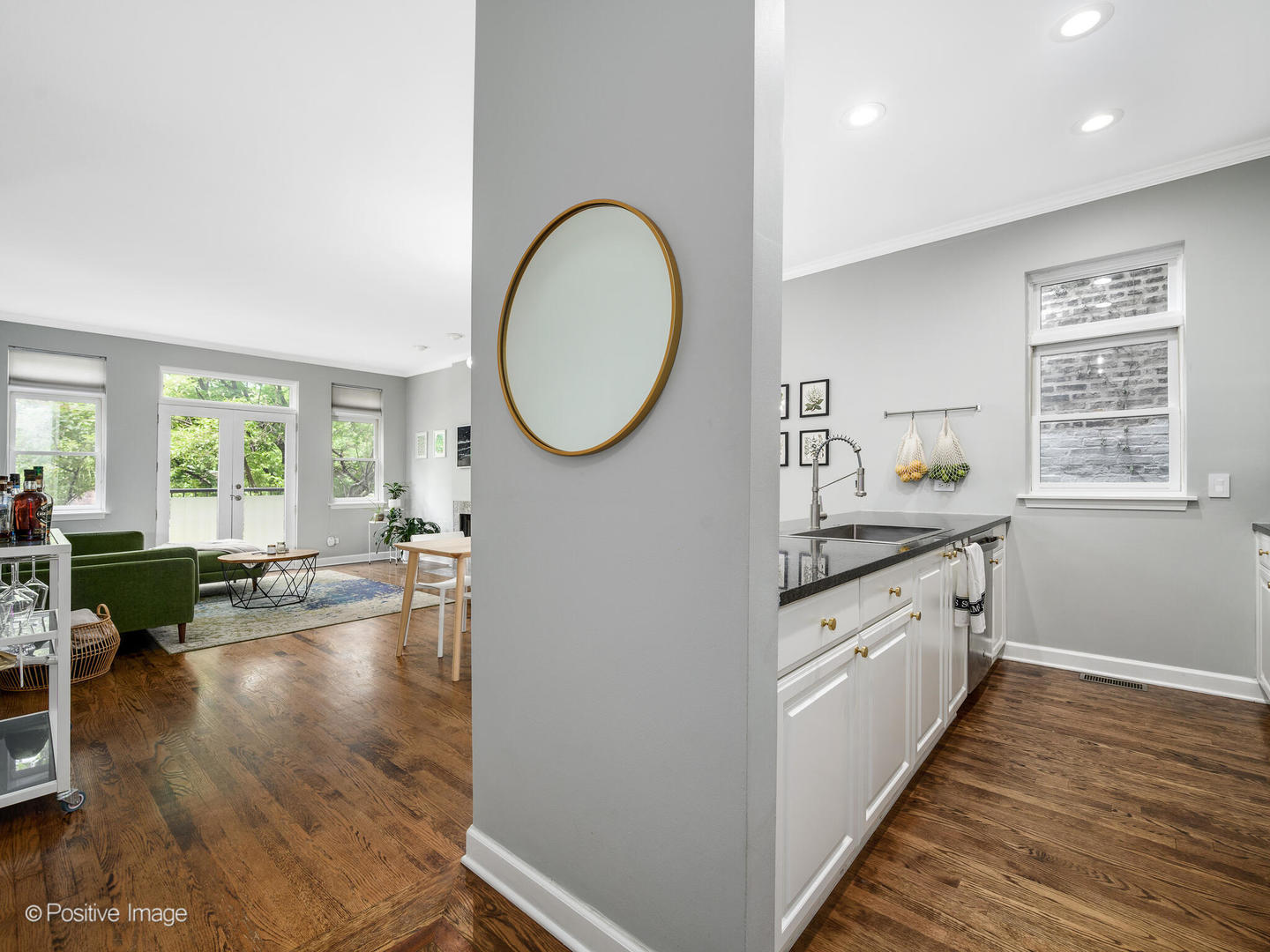 4315 North Kenmore Avenue, Unit 1N Chicago, IL 60613 - Photo 3 of 27 a spacious bathroom with a granite countertop sink a mirror and a large window