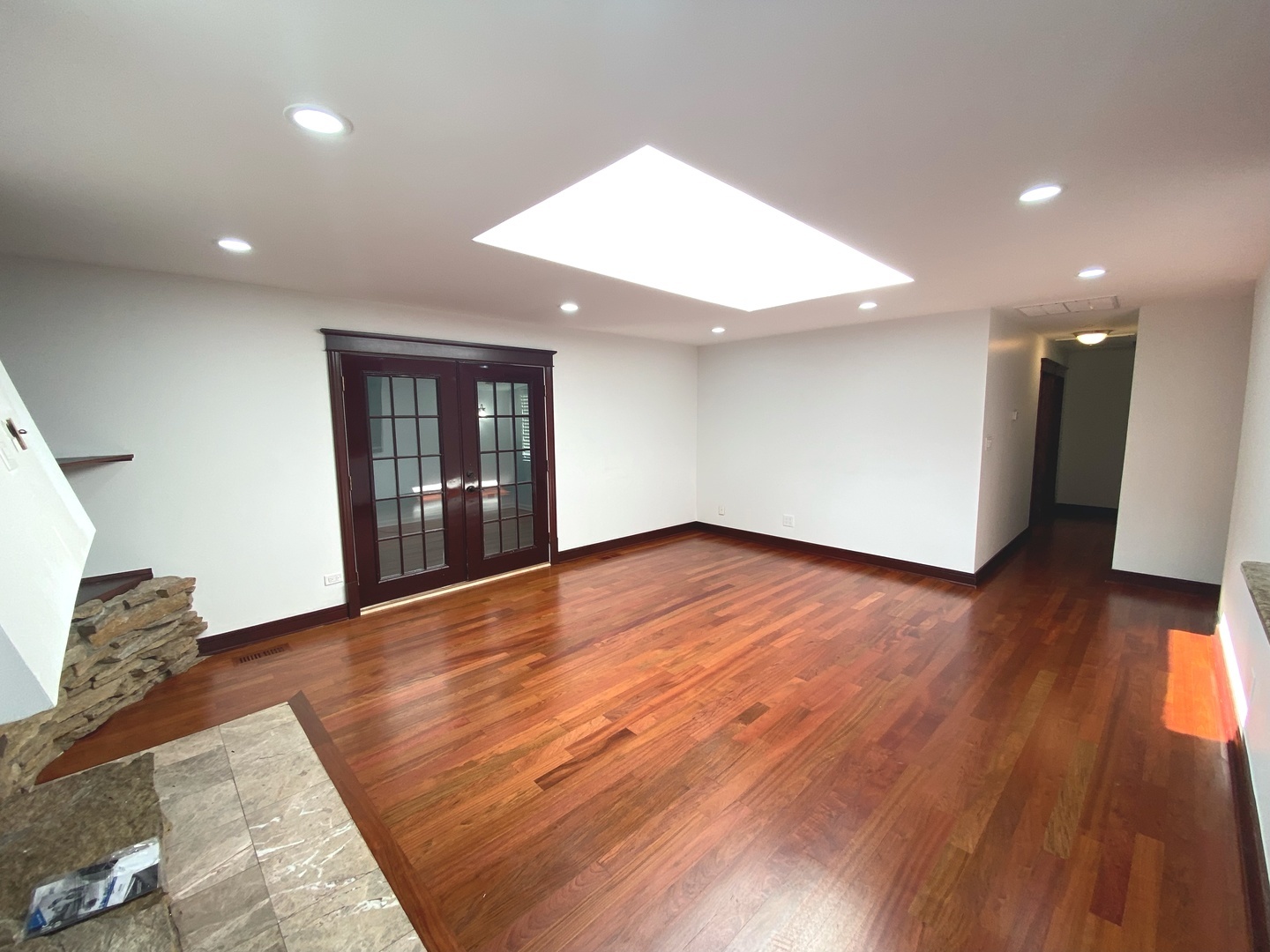 282 Seabury Road Bolingbrook, IL 60440 - Photo 17 of 41 a view of an empty room with wooden floor and a window