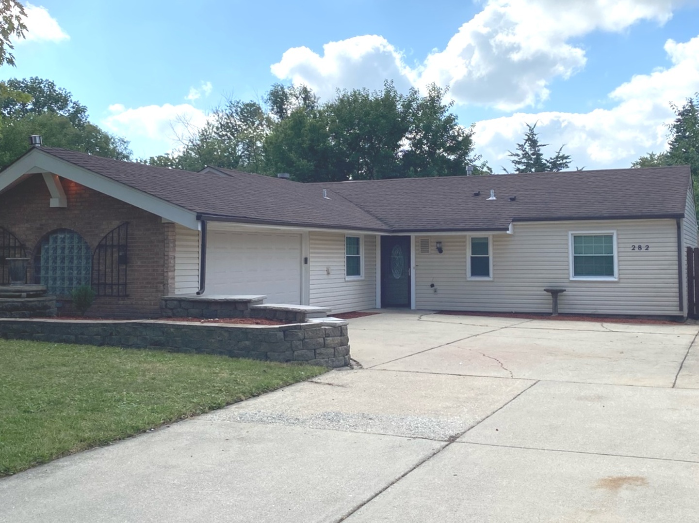 282 Seabury Road Bolingbrook, IL 60440 - Photo 2 of 41 a front view of a house with a garden and yard