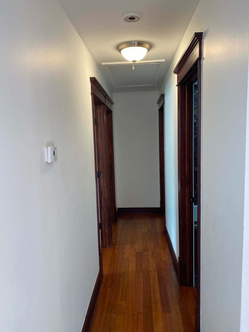 282 Seabury Road Bolingbrook, IL 60440 - Photo 25 of 41 a view of a hallway with wooden floor