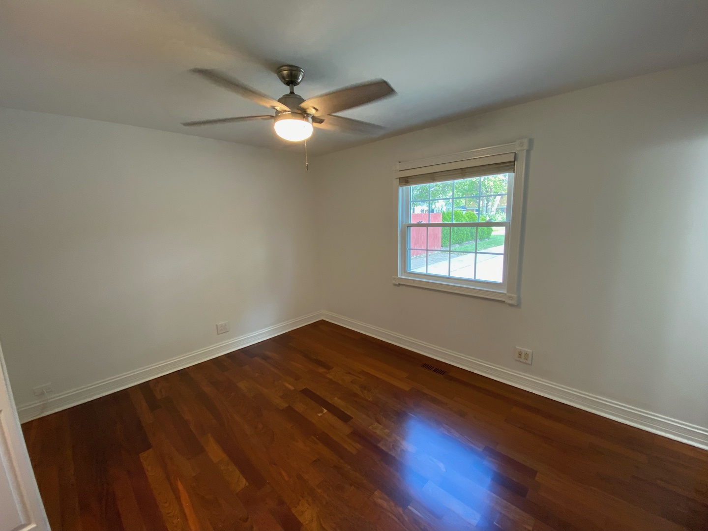 282 Seabury Road Bolingbrook, IL 60440 - Photo 35 of 41 a view of an empty room with wooden floor and a window