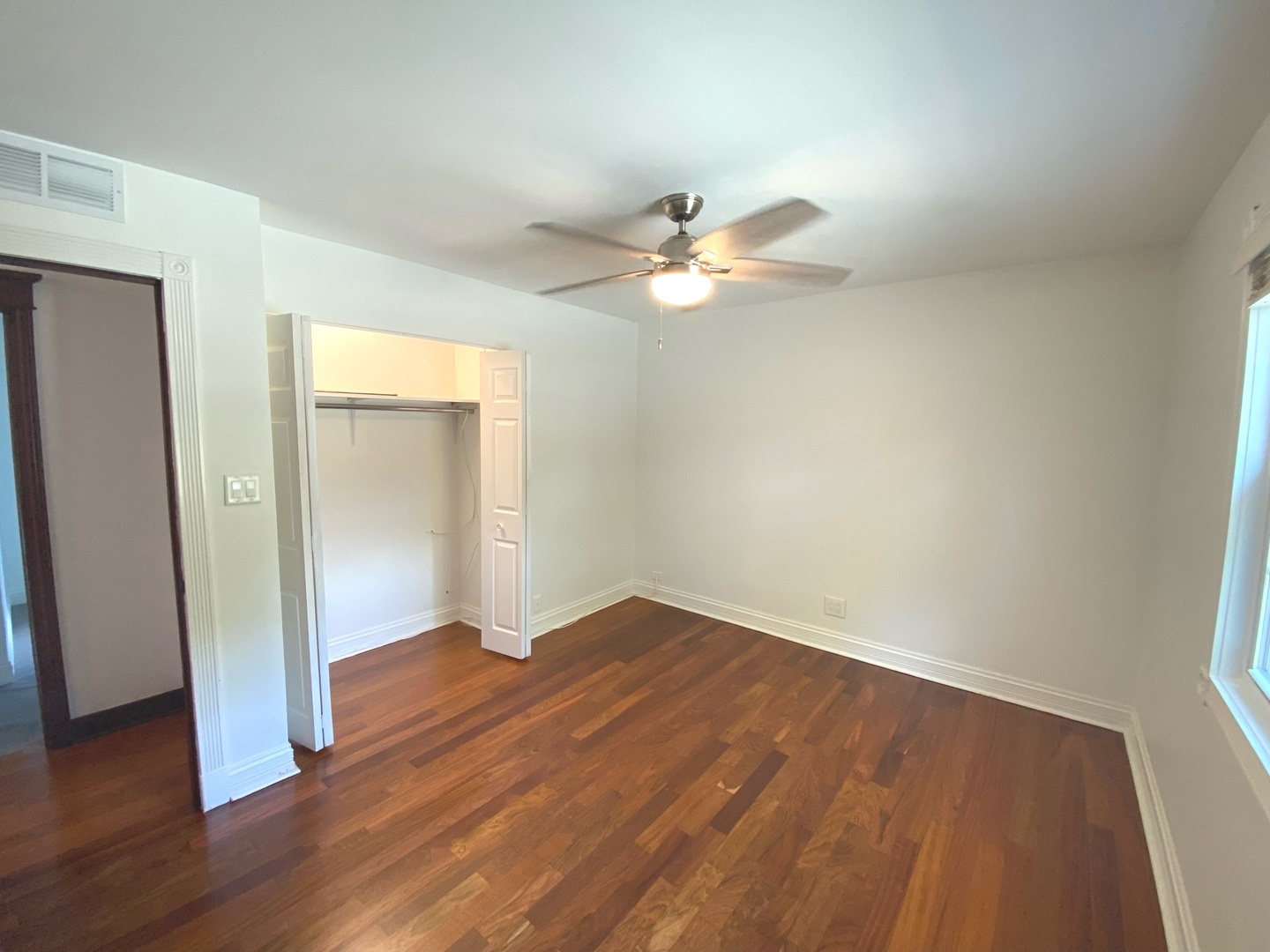 282 Seabury Road Bolingbrook, IL 60440 - Photo 36 of 41 an empty room with wooden floor and ceiling fan