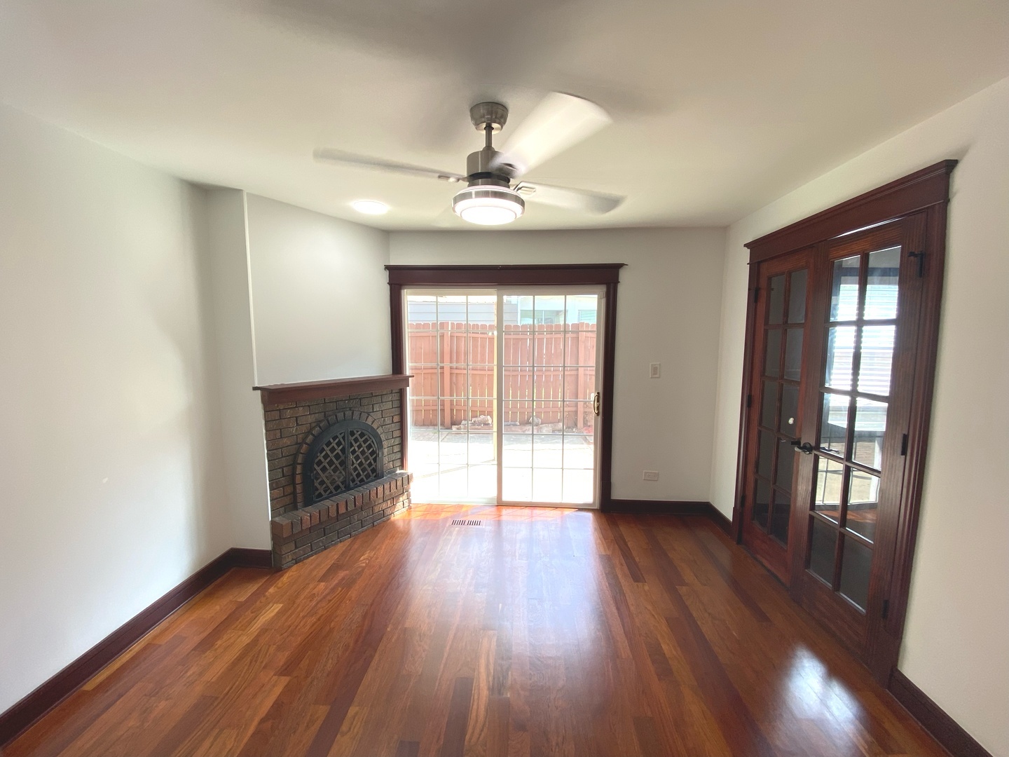 282 Seabury Road Bolingbrook, IL 60440 - Photo 5 of 41 a view of an empty room with wooden floor and a window
