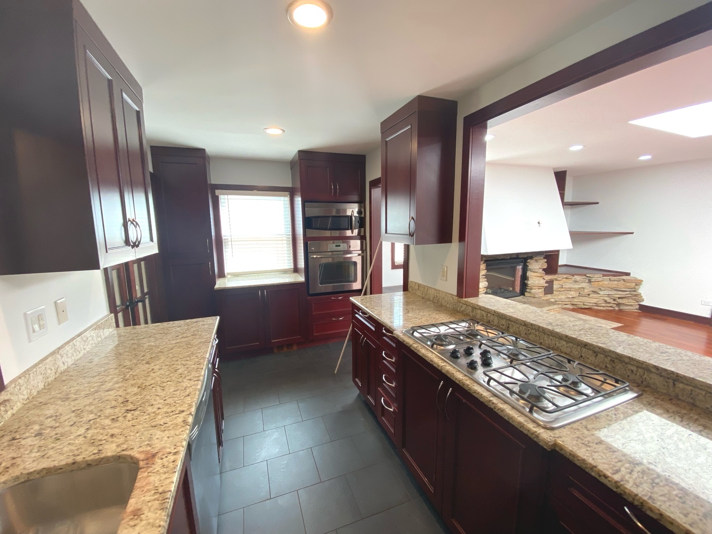 282 Seabury Road Bolingbrook, IL 60440 - Photo 9 of 41 a large kitchen with stainless steel appliances granite countertop a large stove a sink dishwasher and cabinets