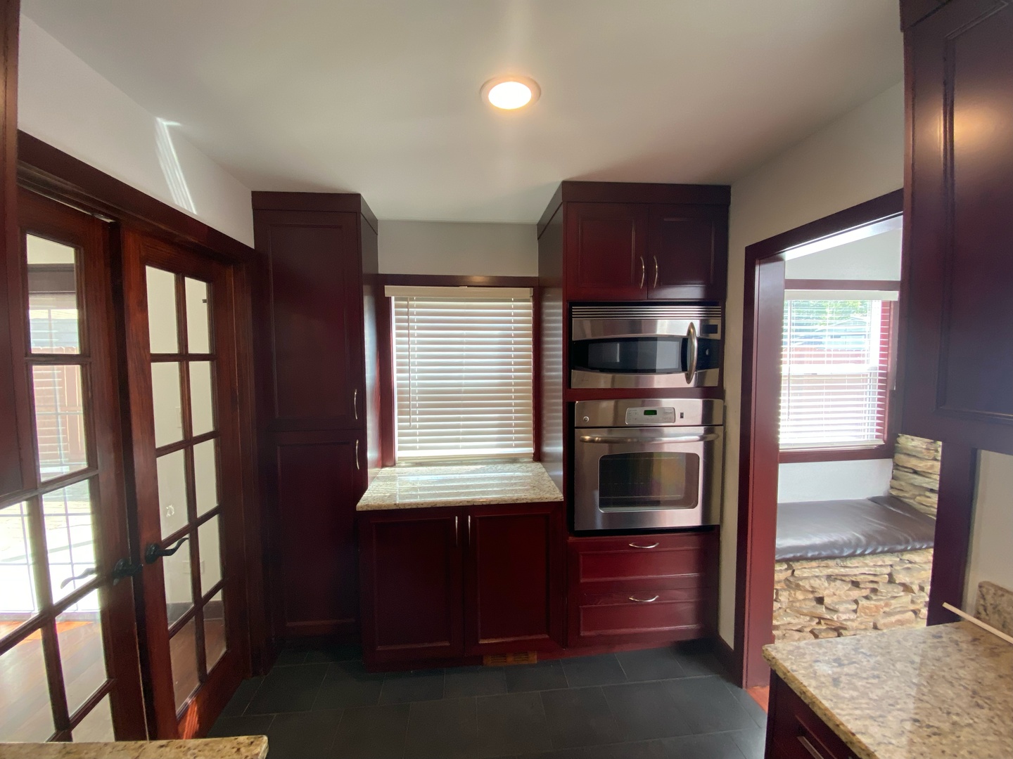 282 Seabury Road Bolingbrook, IL 60440 - Photo 10 of 41 a kitchen with granite countertop wooden cabinets and stainless steel appliances