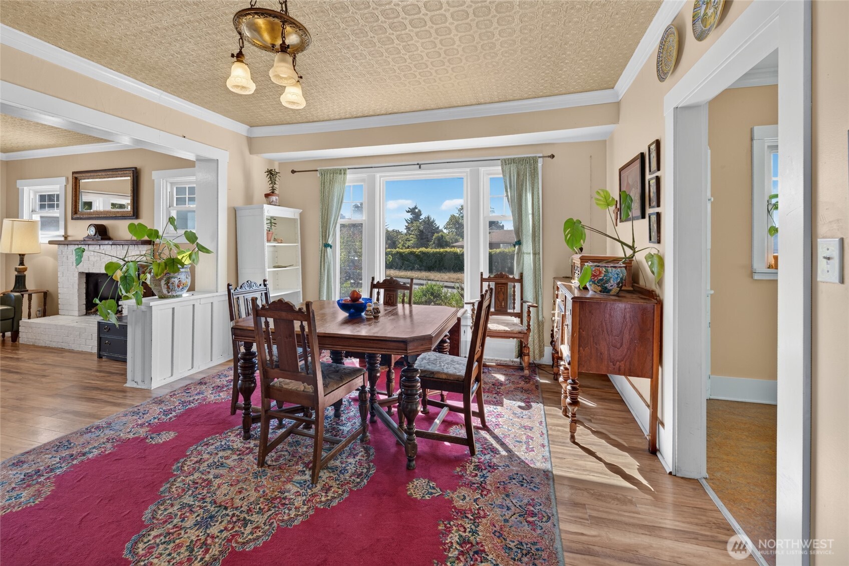 237 West 3rd Street Port Angeles, WA 98362 - Photo 10 of 40 a view of a dining room with furniture window and wooden floor