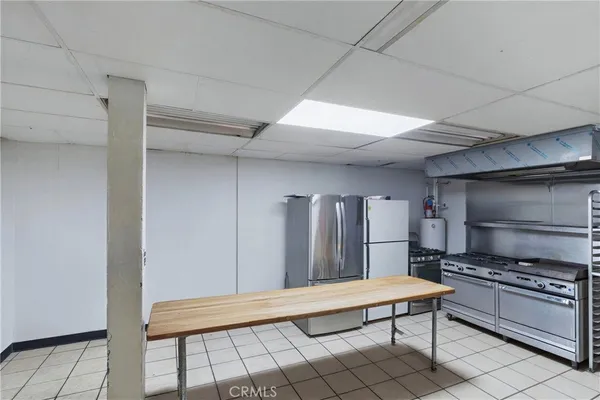 a kitchen with a sink and a refrigerator