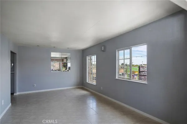 a view of an empty room and window