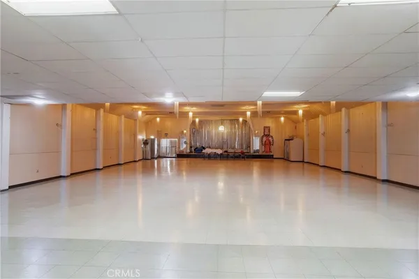 a kitchen with stainless steel appliances a refrigerator and a stove top oven