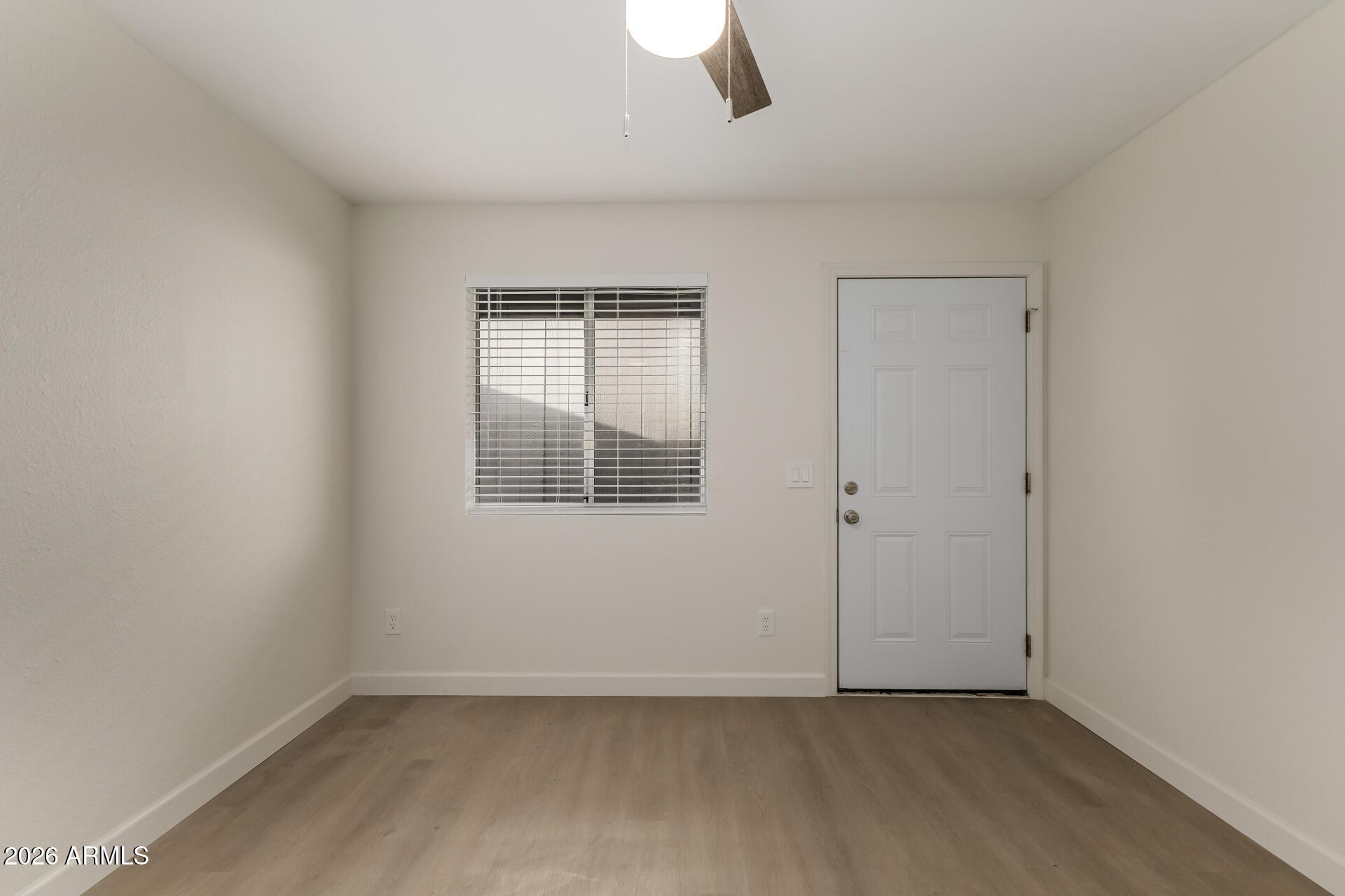 936 West Rio Salado Parkway, Unit 4 Mesa, AZ 85201 - Photo 5 of 20 an empty room with a window