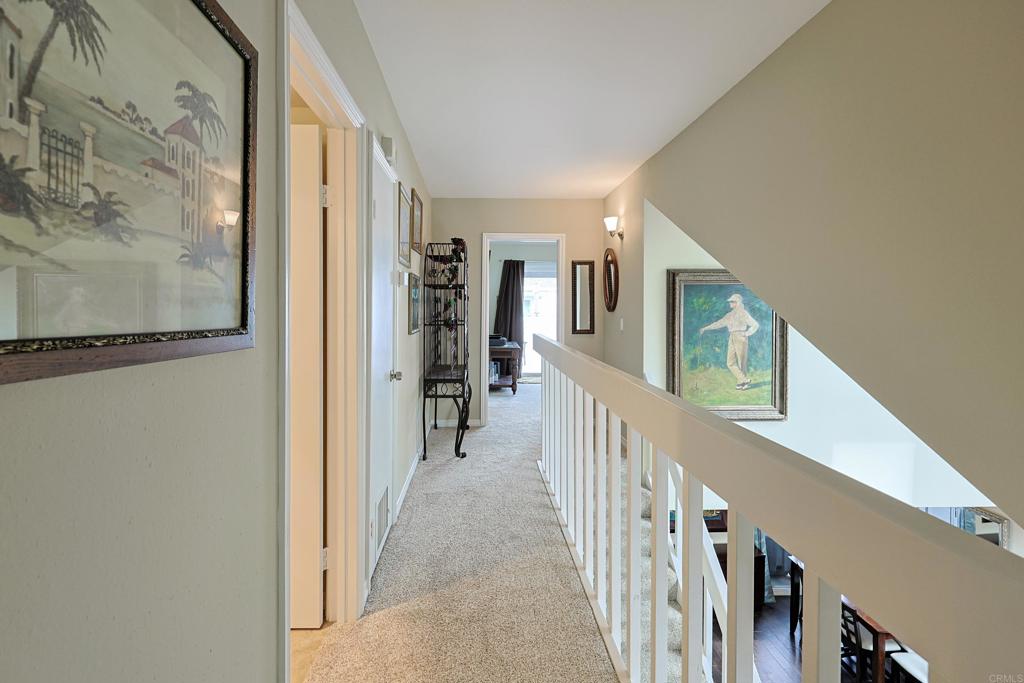 1415 1st Street Coronado, CA 92118 - Photo 19 of 36 a view of a hallway with wooden floor and entryway