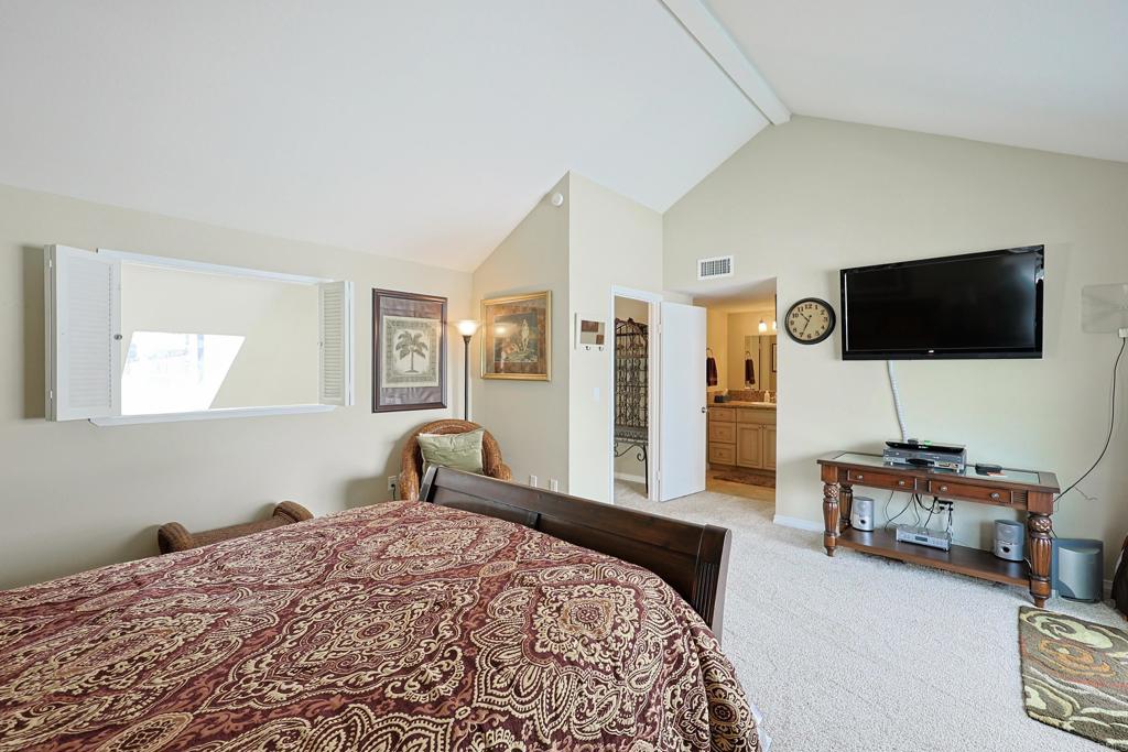 1415 1st Street Coronado, CA 92118 - Photo 24 of 36 a bedroom with a bed and a flat screen tv