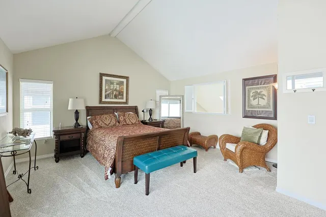 a bedroom with a bed and chair