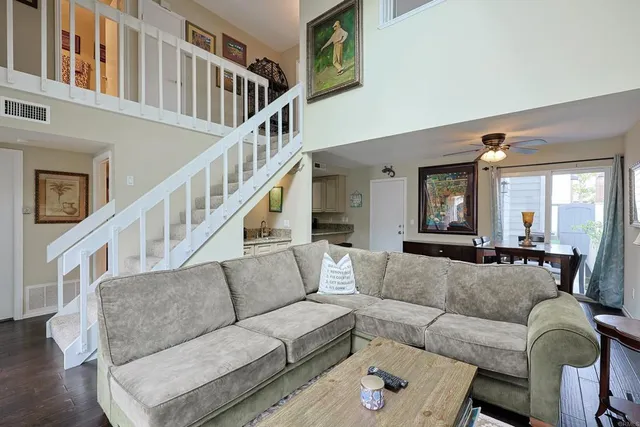 a living room with fireplace furniture and a wooden floor