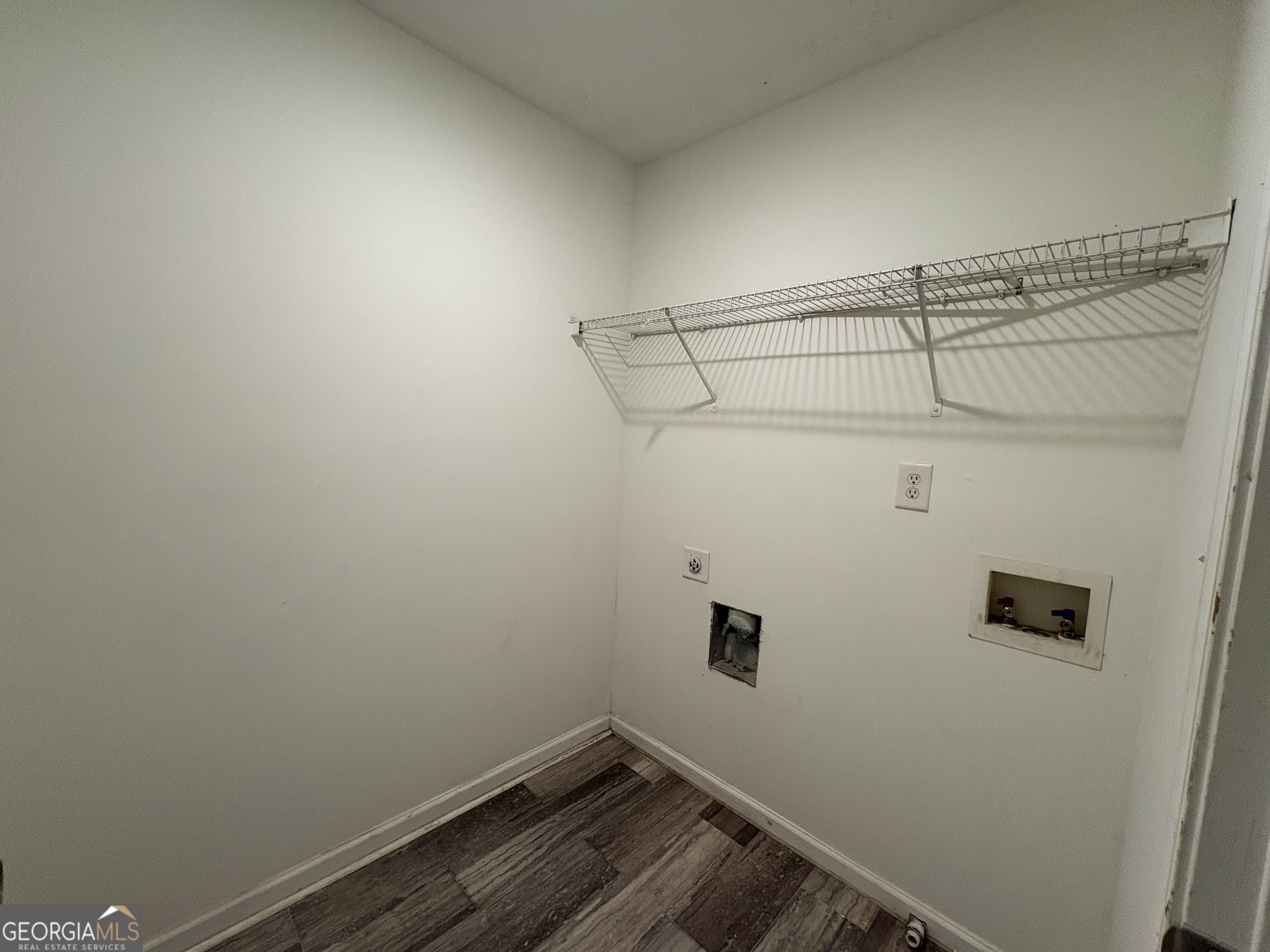 2485 Emma Way Northwest, Unit 2485 Lawrenceville, GA 30044 - Photo 15 of 20 a view of a room with racks on the wall