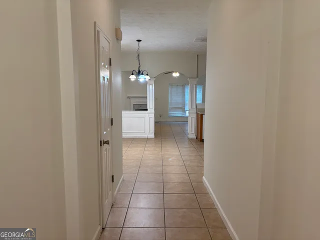 a view of a hallway with a white walls