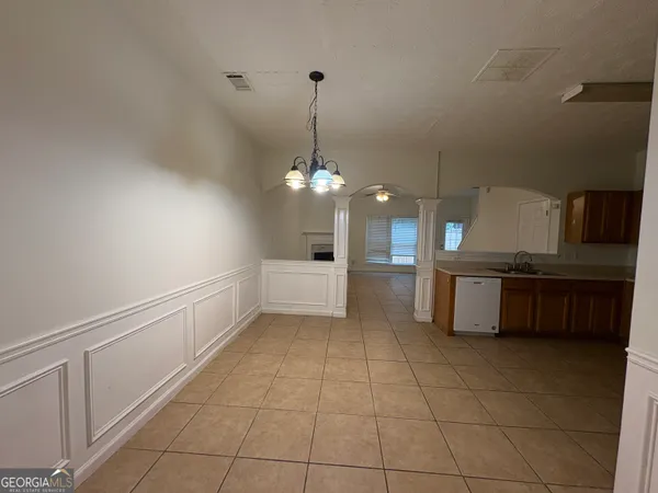 a view of a kitchen with a sink
