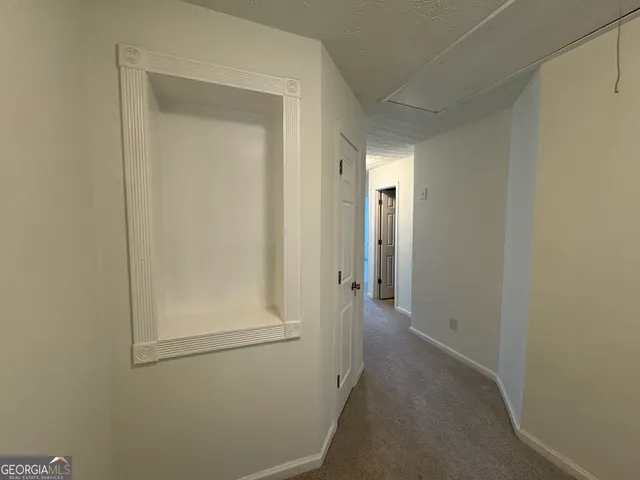 a view of a hallway with closet