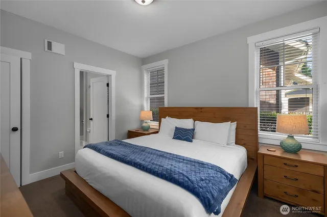 a bedroom with a bed and window