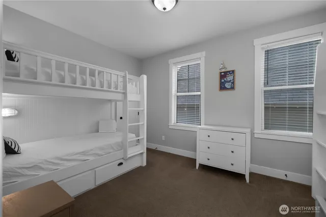 a room with a bed and a window