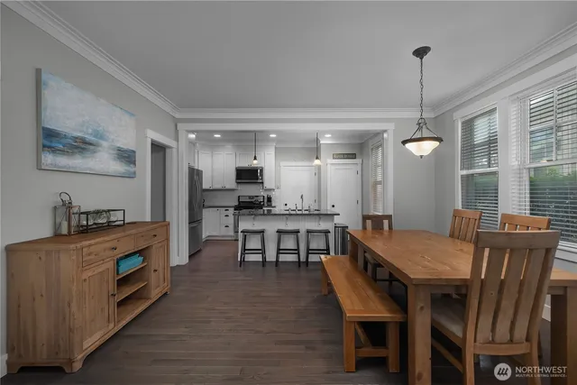 a view of a dining room with furniture window and wooden floor