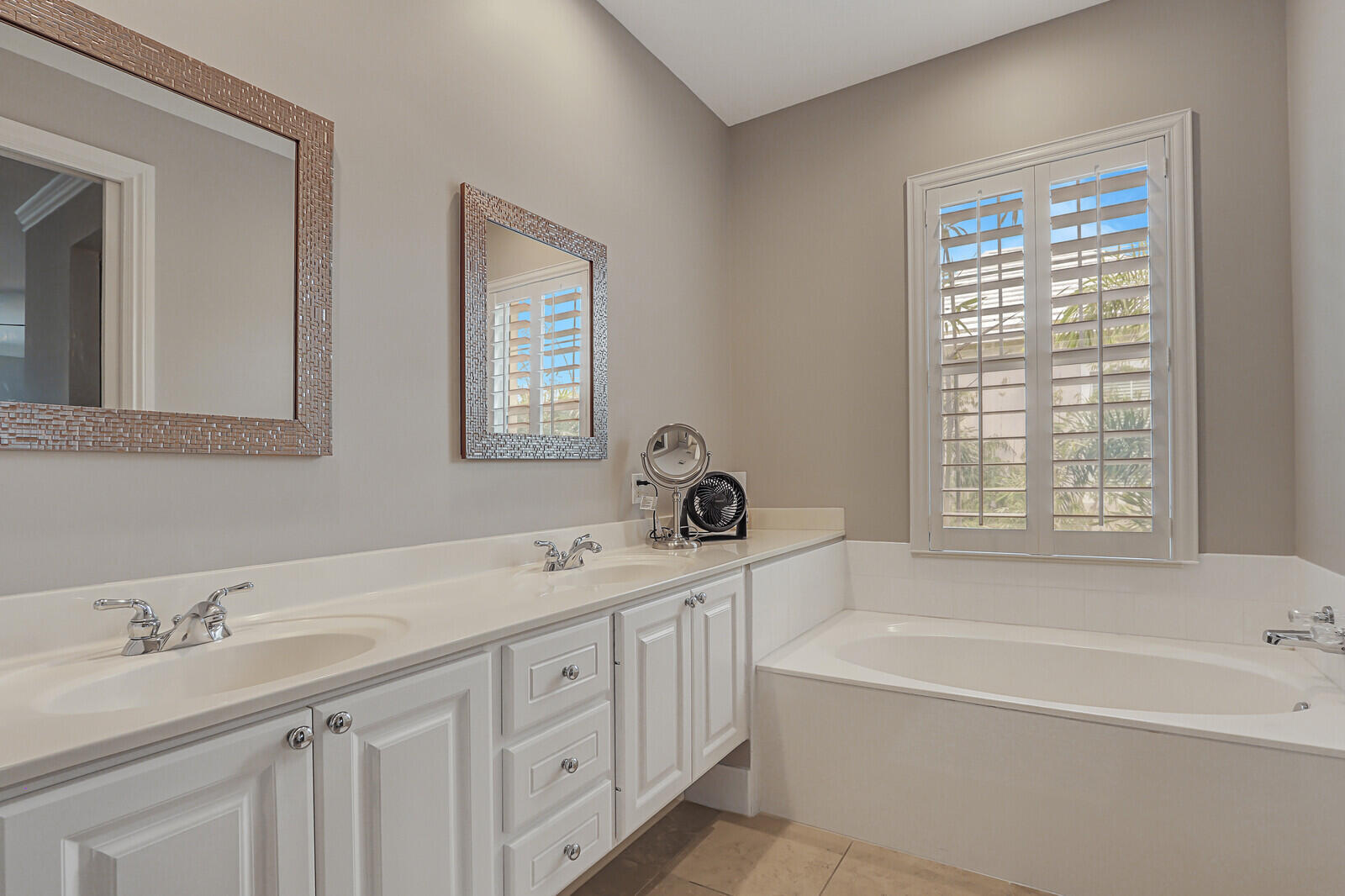 101 St Pierre Way Jupiter, FL 33458 - Photo 30 of 57 a bathroom with a tub a sink and mirror