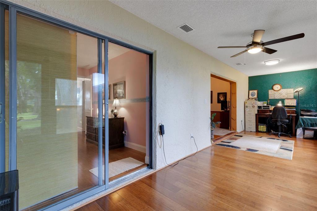 1065 Tartan Drive, Unit C Palm Harbor, FL 34684 - Photo 21 of 91 a view of a livingroom with a furniture and a ceiling fan