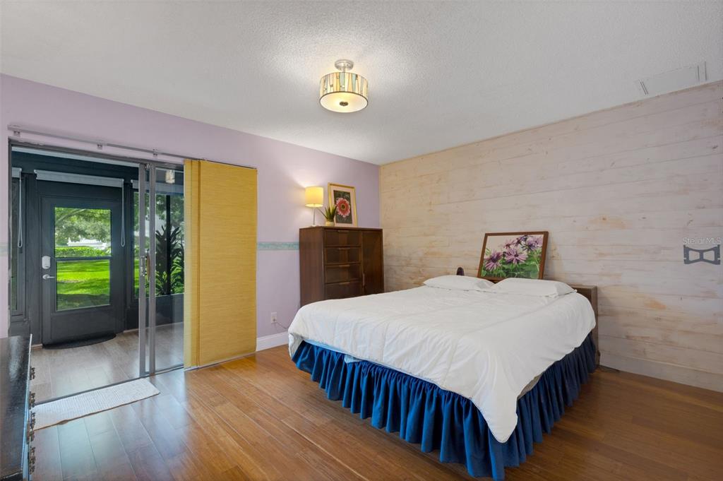 1065 Tartan Drive, Unit C Palm Harbor, FL 34684 - Photo 24 of 91 a bedroom with a bed and a table