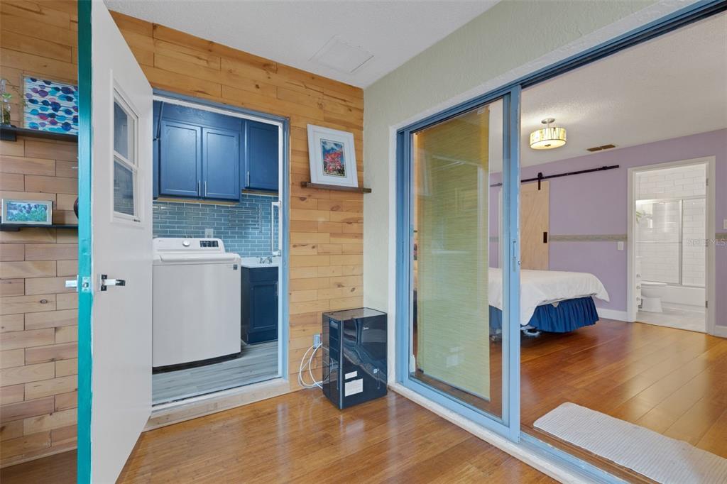 1065 Tartan Drive, Unit C Palm Harbor, FL 34684 - Photo 36 of 91 a view of kitchen with furniture and wooden floor