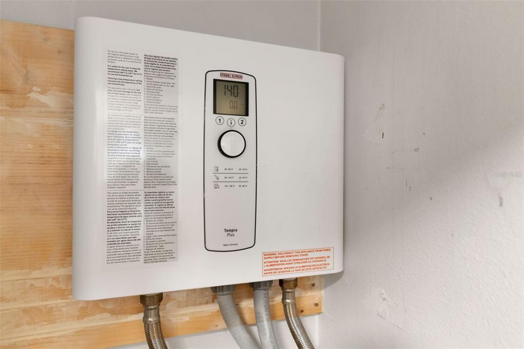 1065 Tartan Drive, Unit C Palm Harbor, FL 34684 - Photo 38 of 91 a view of a door and chair